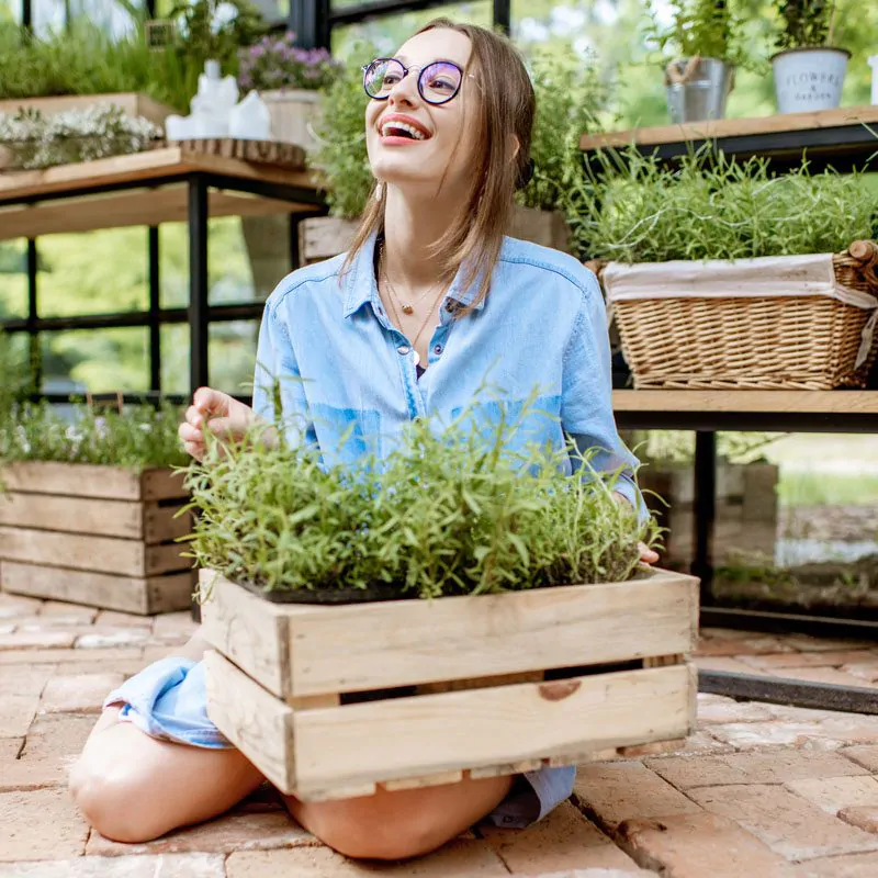 woman-with-herbs-in-the-greenhouse-2021-09-02-09-18-31-utc-2.jpg